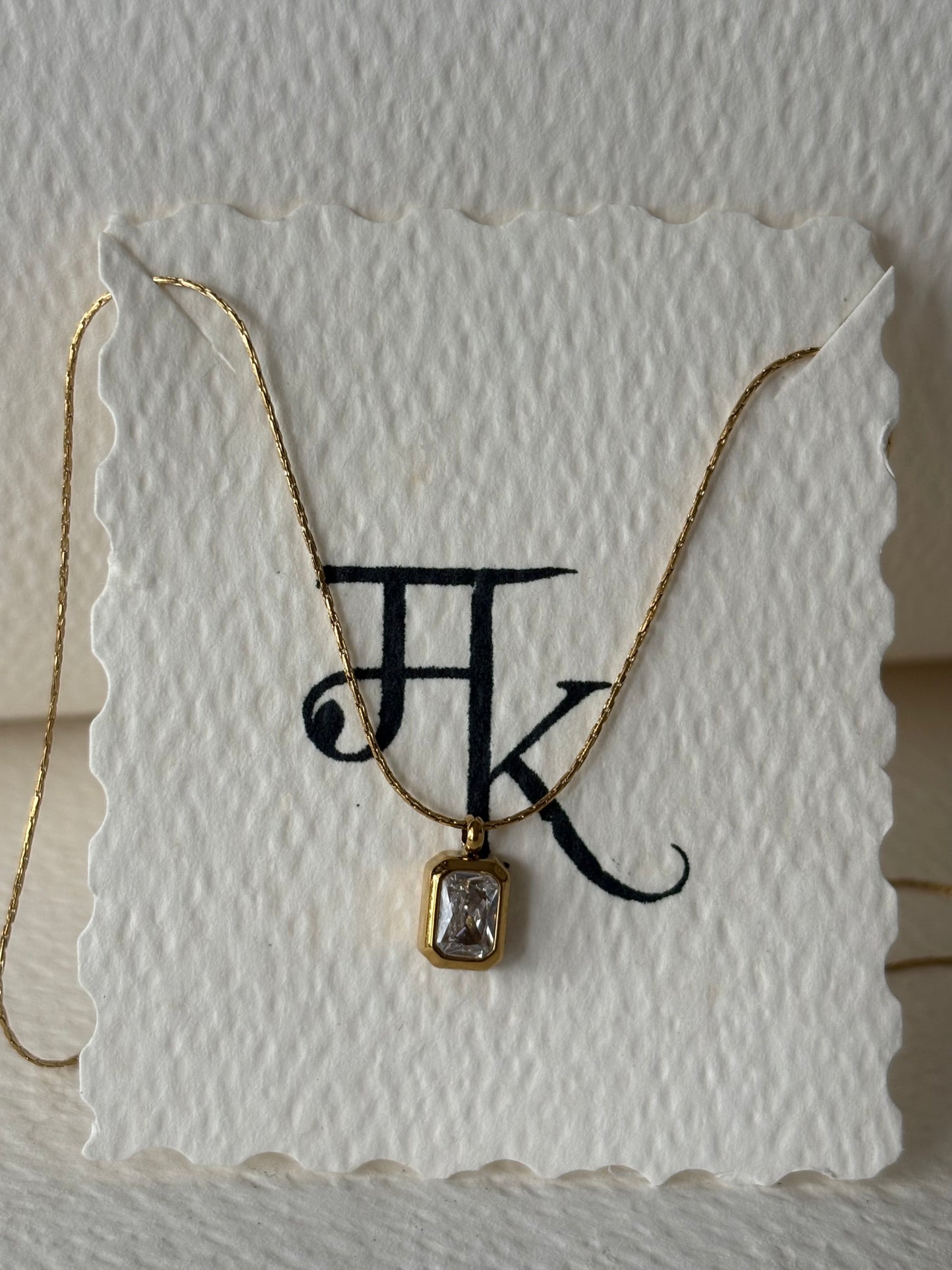 The Bezel Emerald-Cut Solitaire Necklace